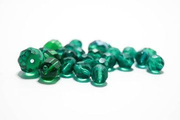 green beads on white backround