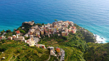 Fototapeta na wymiar Corniglia - Village of Cinque Terre National Park at Coast of Italy. Province of La Spezia, Liguria, in the north of Italy - Aerial View - Travel destination and attractions in Europe. 