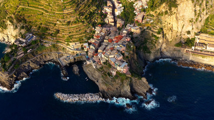 Village of Manarola in aerial view, Cinque Terre coast of Italy. Manarola is a small town in the province of La Spezia, in Liguria, in northern Italy and one of the Cinque Terre attractions for touris