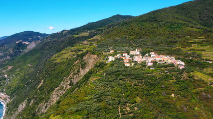 Fototapeta premium Riomaggiore Cinque Terre is a traditional and colorful fishing village near a cliff on the Mediterranean Sea, located on the Ligurian coast in Italy. 