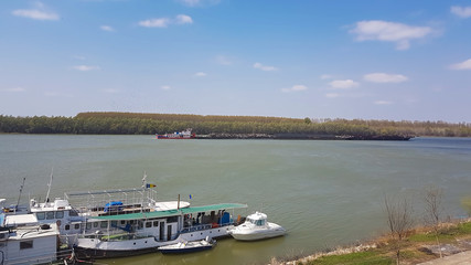 Fototapeta premium old barge.cargo boat transporting old iron. industrial concept