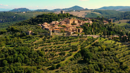 An Italian village with green meadows all over the village. Aerial view with a drone of the beautiful and old village of Monticchiello in Tuscany, Italy	 - 331288202