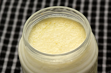 Close up creams on Turkish yogurt in jar