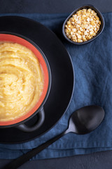 Yellow pea puree in a bowl. Flat lay composition