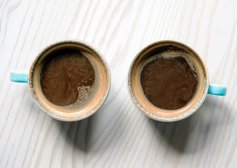 two cups of coffee on the table top