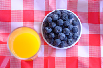 berry fruits, juice and banana on table for breakfast 