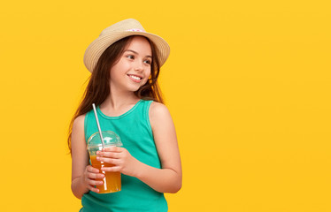 Happy young girl having refreshment with takeaway beverage and plastic straw