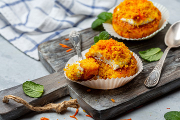 Traditional carrot mini cakes in paper capsules.