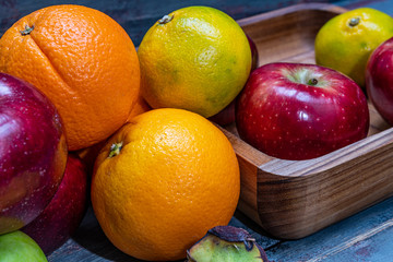 red and green apples oranges and tasty tangerines along with other fruits