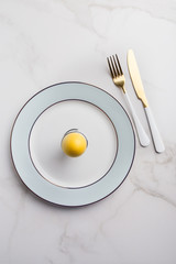 Easter table set with knife and fork on white background