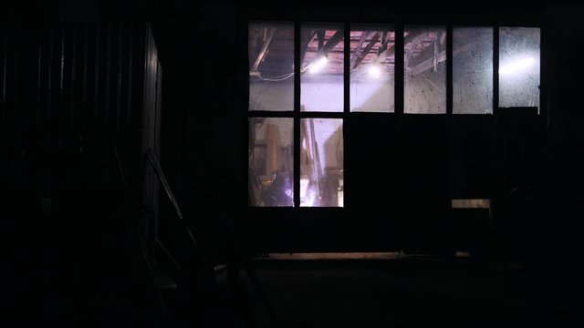 alone working man use arc welding into the night