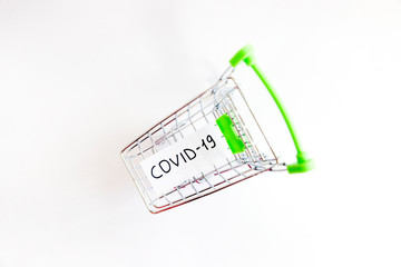 Empty shopping trolley with covid-19