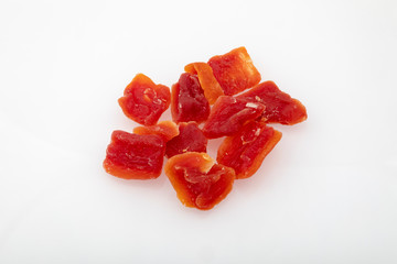 pieces of dried papaya on a white background