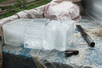 Tools for cutting ice. Ice delivery man in a Cambodian village