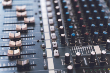 Sound mixer. Professional audio mixing console with lights, buttons, faders and sliders.