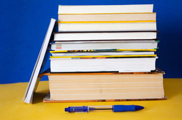 Group of books on a blue background. Concept: reading, literature and education