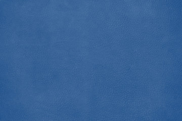 Leather texture background surface  toned in trendy color 2020 year classic blue. Close-up.