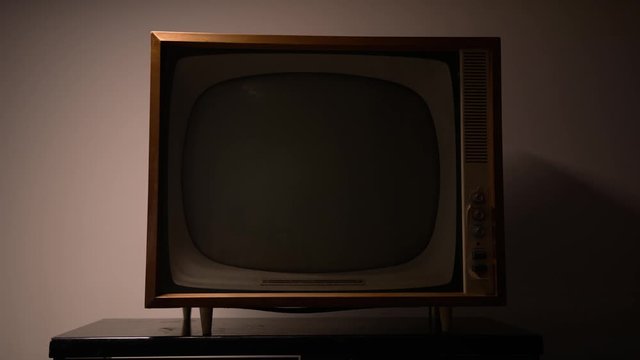 Vintage television on a table , retro revival and broadcasting concept