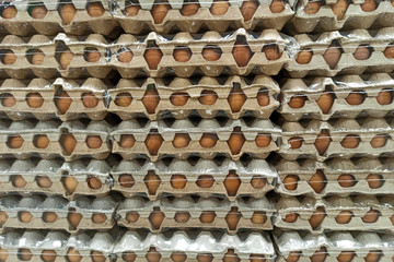 A lot of eggs in the package. Abstract background. Image for design and project.