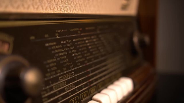 light revealing vintage forgotten radio in the dark room