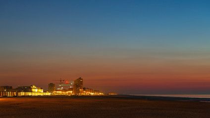Obraz premium Panorama of Oostende (Ostend) city at sunset with its waterfront promenade, beach and North Sea, Belgium.