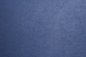 Dark blue metallic textured background with a gradient.