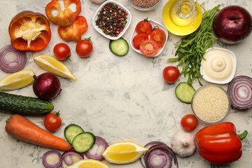 Set of sliced vegetables and spices for the preparation of salads or other dishes on a light table. ingredients for cooking. top view