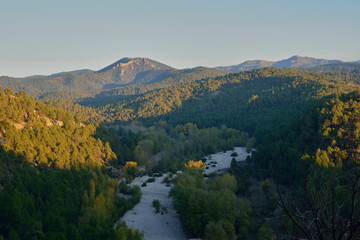 Narrow river between the green mountains