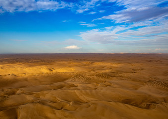 Fototapeta na wymiar Aerial picture of the landscape of the Namib Desert and the Atlantic Ocean on the Skeleton Coast in western Namibia