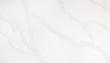 Beautiful closeup of a white marble looking quartz slab with grey veining