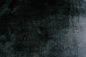 Old black background. Grunge texture. Dark wallpaper. Blackboard. Chalkboard. Concrete