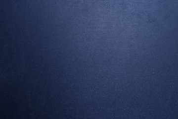 Dark blue metallic textured background with a gradient.