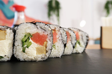 Close-up of sushi rolls on a board