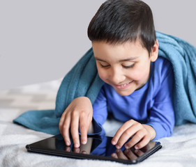 child on distance learning. technology, people and lifestyle, distance learning, online education concept. happy kid with tablet.