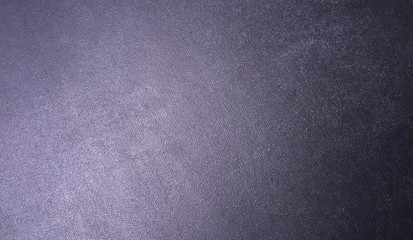 Gray metal textured background with a gradient.