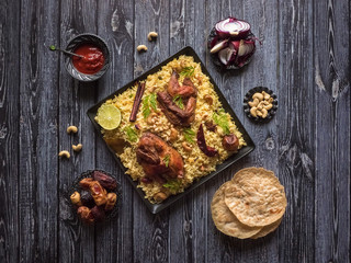 Festive dish with baked chicken and rice. Mandi Kabsa, Yemenis style