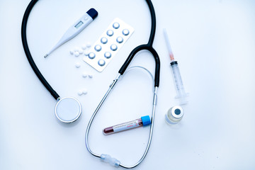 Coronavirus Covid-19 outbreaking. Medicine and epidemic concept. Doctor hand in medical glove holding tube with positive blood test result for rapidly spreading Coronavirus 2019-nCoV in laboratory.