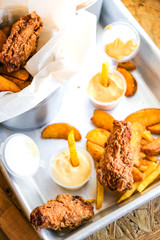 crispy, juicy snacks with delicious sauce. wings, fries, potato wedges, nuggets