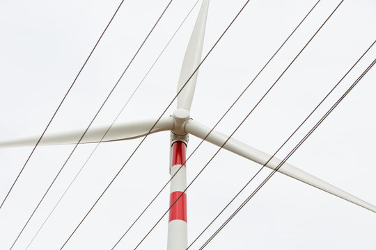 Wind Turbine with energy cables on a big wind farm.