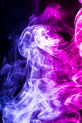 Colored smoke on black background