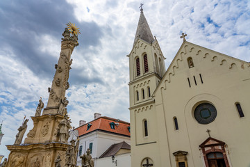 Views of the city of Veszprem with king Saint Stephen / Szent Istvan cathedral and trinity statue on the trinity square - Powered by Adobe