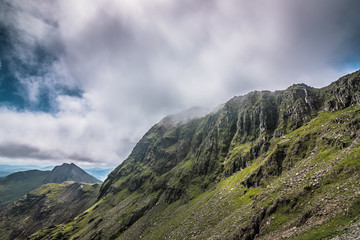 Snowdonia National Park landscape with green mountains and clouds, Gwynedd, North Wales, UK