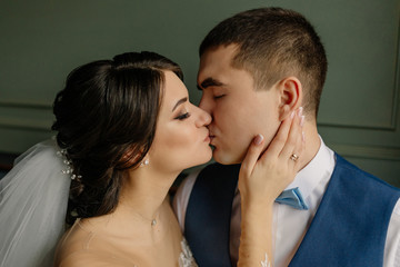 Beautiful wedding, newlyweds hugging and kissing each other. Love, wedding concept.