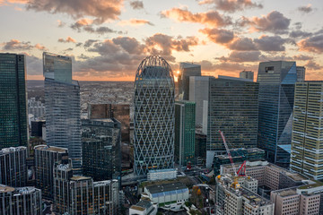 Aerial drone shot of La Defense business district skyscrapers during sunset