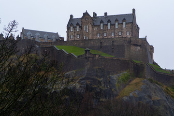 Fototapeta na wymiar View on Castle hill in old part of Edinburgh city, capital of Scotland, in rainy winter day.