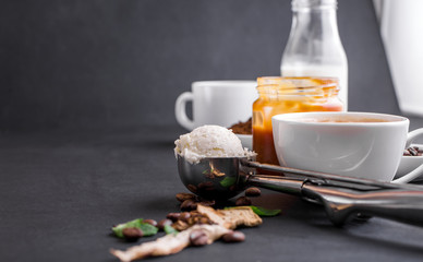 Composition on a yair background with milk, fragrant coffee, salted carmela, dried mushrooms, mint.