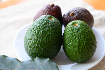 Fresh ripe green and brown avocados ready to eat