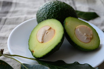 Fresh ripe green avocados with seeds ready to eat