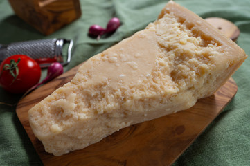 One piece of authentic Parmigiano-Reggiano or Parmesan Italian hard, granular cheese