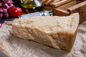 One piece of authentic Parmigiano-Reggiano or Parmesan Italian hard, granular cheese